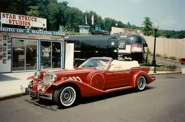The Star Struck Studios shopfront at Lake Compounce, signed PHOTO ON A MAGAZINE COVER, with the Airstream behind it and a red neoclassic roadster parked in front.
