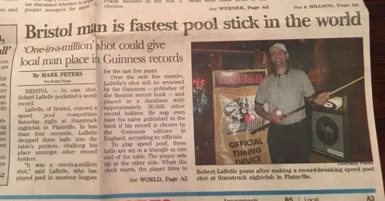 A newspaper clipping headlined about the fastest pool stick in the world, reporting a record-breaking trick shot made at Starstruck.